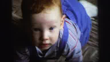 Lynbrook New York (1971): Zoom In Of Baby Boy Crawling Baby Boy Sitting On A