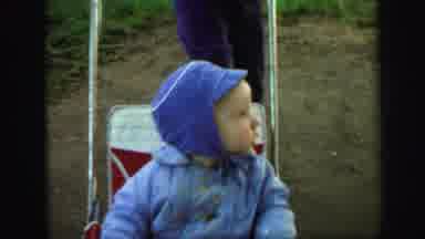 LYNBROOK NEW YORK-1971: Little Boy In Blue Rocks Back And Forth Trying To Make