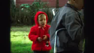 Lynbrook New York (1971): Blond Child Gender Unclear In Red Jacket And Hood Adult