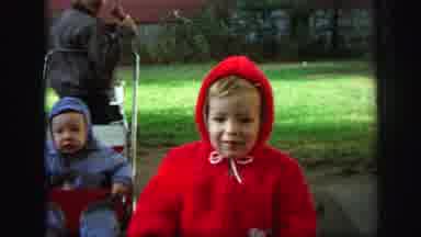 Lynbrook New York (1971): Baby Red Outfit With Hood Walking Baby In The Background
