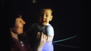 Lynbrook New York (1971): Mother Holding Baby While Both Wave Goodbye To Father