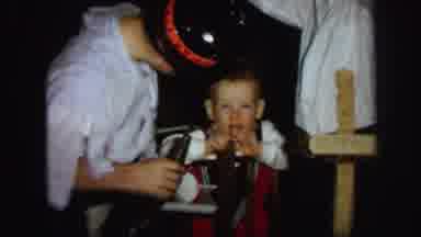 Lynbrook New York (1971): Boy Wearing Black Hat Scares Baby With New Year Eve