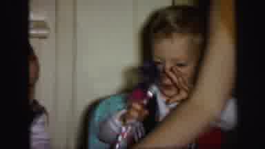 Lynbrook New York (1971): Two Boys In High Chairs Play Noisemakers Mom Leans Over