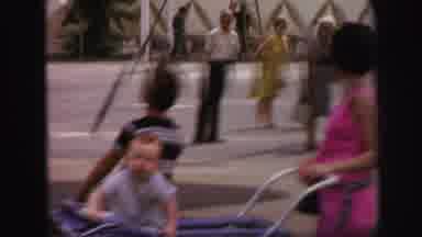 Lynbrook New York (1971): Baby Sits In Antique Stroller While Smiling And Waving