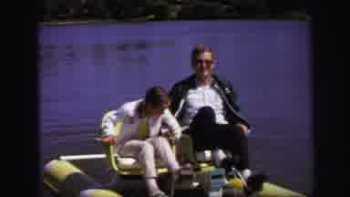 Lynbrook New York (1971): Old Man And Young Girl Paddling On Water