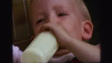 Lynbrook New York (1971): Baby Drinking Bottle And Falling Asleep