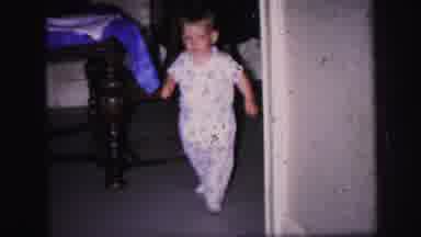 Lynbrook New York (1971): A Young Boy Walks Around Corner From Other Room Into