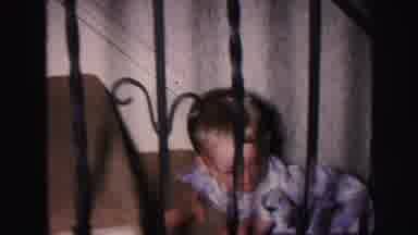 Lynbrook New York (1971): A Woman Lifts A Toddler Dressed In Pajamas By The Arms