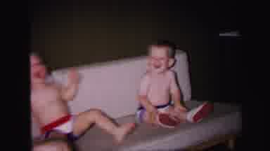 Lynbrook New York (1971): Two Boys In Red White And Blue Shorts Playing Around On
