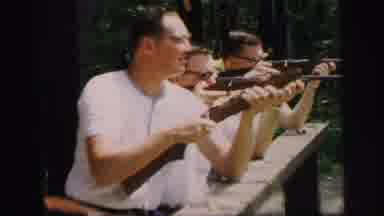 Lynbrook New York (1971): Men Shooting Gun At A Range And Aiming At A Target