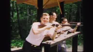 Lynbrook New York (1971): Men Wearing White Shirt Fire Rifles At Gun Range On A