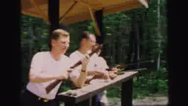 Lynbrook New York (1971): Three Young Men Wearing White Shirts Shooting Rifles