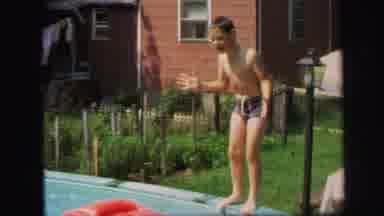 Lynbrook New York (1971): A Young Child Prepares To Do A Front Flip In His Above