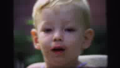 Lynbrook New York (1971): Child Happy After A Meal He Speaks With His Mum And Suck
