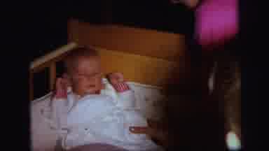 Lynbrook New York (1971): Infant Sits In Crib With His Eyes Partially Shut While