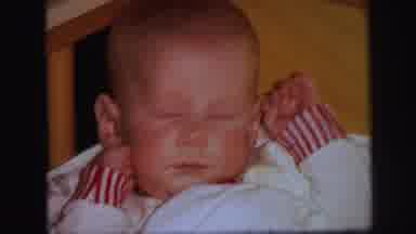 Lynbrook New York (1971): Sleepy Baby Laying In The Corner Of A Crib Covered With