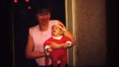 Lynbrook New York (1971): Mother Puts Her Baby In Christmas Dresses And Laughs