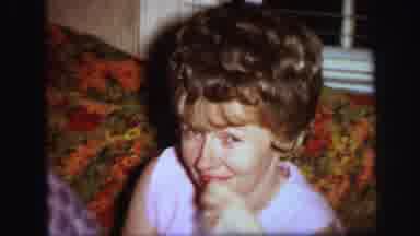 Lynbrook New York (1971): Older Woman Smiles At A Holiday Family Gathering Next To