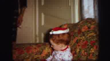 Lynbrook New York (1971): A Young Boy Playing With A Santa Hat In His Pajamas