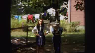 Lynbrook New York (1971): A Girl Practicing Her Baton In The Yard With Male Friend