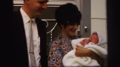 Lynbrook New York (1971): Woman Holds Baby In White Blanket On A Clear Sunny Day
