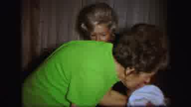 Lynbrook New York (1971): The Grandmother Picks Up Kicking Baby From Young