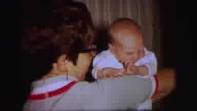 Lynbrook New York (1971): A Baby Crying And Squirming In The Arms Of A Woman