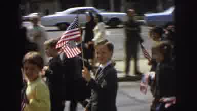 Lynbrook New York (1973): Children Wearing Grey Uniforms Carry American Flags In