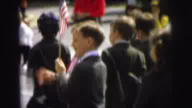 Lynbrook New York (1973): Boys Walk In A Parade Most Of Them Carry Flags Some Wear