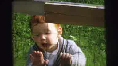 Lynbrook New York (1973): Young Redhead Little Boy Looking And Smiling Behind A