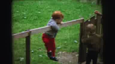 Lynbrook New York (1973): Little Boys In A Yard Climbing On A Small Fence Near A