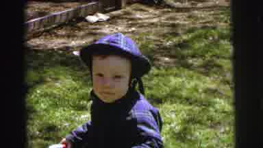 Lynbrook New York (1973): Toddler Boy In Purple Outfit Sitting On Grass Saying Mom