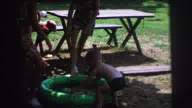 Lynbrook New York (1973): The Baby's Are Playing With The Water Tub On The Garden