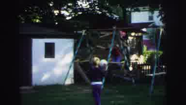 Lynbrook New York (1973): Children Play On A Children's Swing Installed Outside