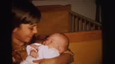 Lynbrook New York (1973): A Baby Being Held And Nurtured By Its Mother
