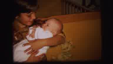 Lynbrook New York (1973): Boy Holding And Rocking A Baby With A Cake Saying God