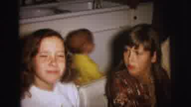 Lynbrook New York (1973): Smiling Children Joining Each Other At The Table For A