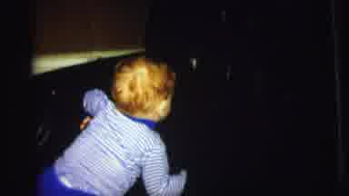 Lynbrook New York (1973): A Toddler Is Looking At An Unknown Object Then Turns And