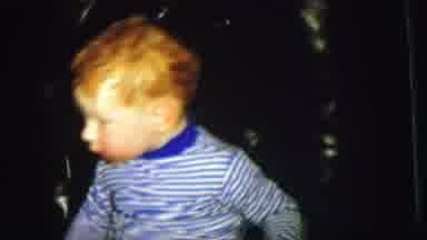 Lynbrook New York (1973): A Little Anxious Toddler Is Very Agitated In His Chair