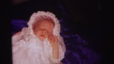 Lynbrook New York (1973): A Tiny Baby Girl Lying In A Frilly Dress And Bonnet