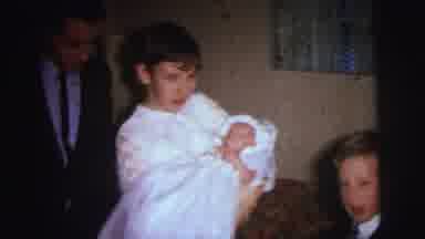 Lynbrook New York (1973): Woman Wearing White Shirt Holds Baby Wearing White