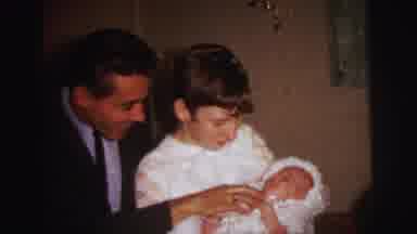 Lynbrook New York (1973): Older Sister Holding A Baby While The Dad Is Trying To