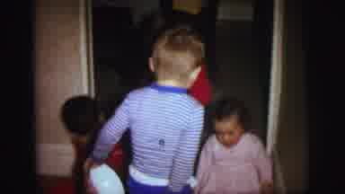 Lynbrook New York (1973): Children Sit In A Door To A Hallway While Another Walks