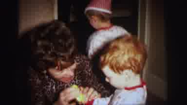 Lynbrook New York (1973): Toddlers In Matching Pajamas Play With A Woman And A