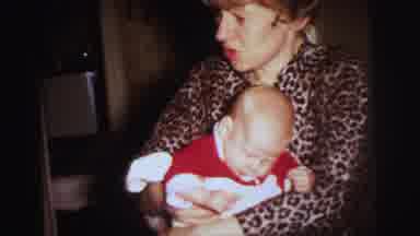 Lynbrook New York (1973): Entertaining Baby In Mom's Loving Arms Toys And Books