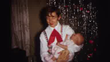 Lynbrook New York (1973): Person Wearing White Shirt With Red Tie Holds Baby