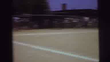 Lynbrook New York (1973): Man Walks Past Baseball Game On A Bright Sunny Day