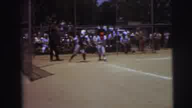 Lynbrook New York (1973): A Kid In A Red Helmet Swings A Baseball Bat Hard At An