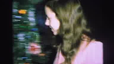 Lynbrook New York (1973): Woman In Pink Enters Room With People Opening Gifts