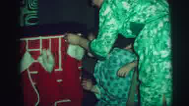 Lynbrook New York (1973): Mother Shows Her Child How A Christmas Stocking Is Hung